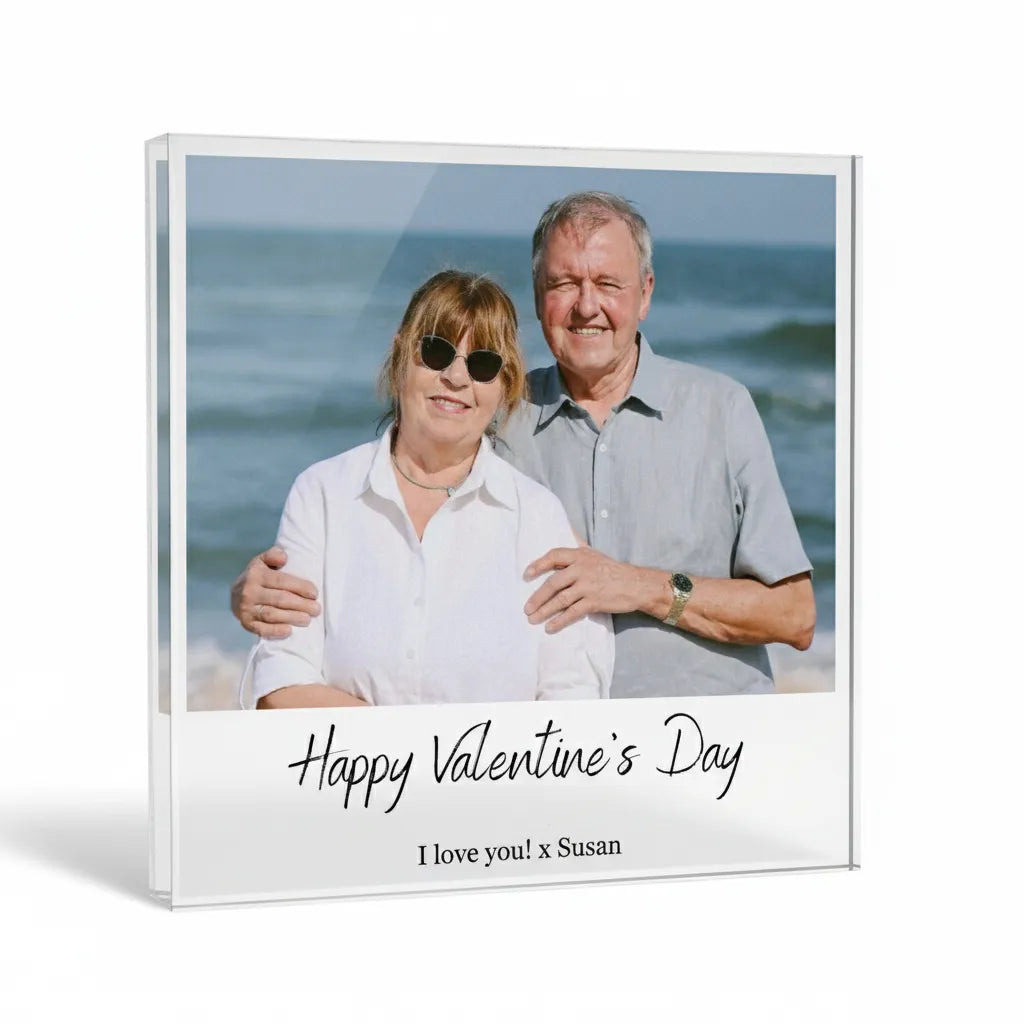 Acrylic glass photo block with a couple on a beach and 'Happy Valentine's Day' text.